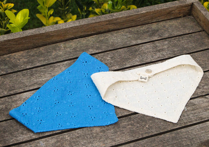 Eyelet cat bandana with breathable cotton fabric and stylish design.