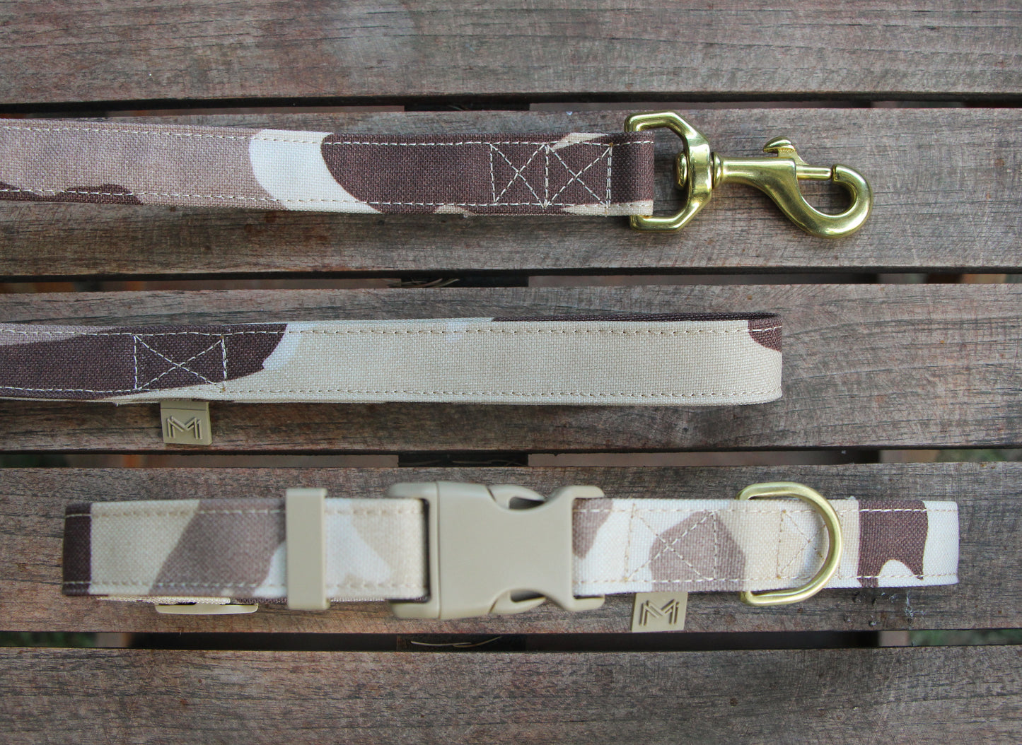 Camouflage patterned dog collar and leash made from a durable cotton-polyester blend.