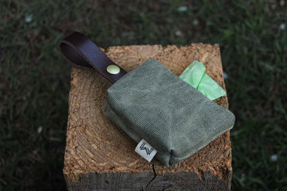 Green Personalized Dog Poop Bag Holder with a stylish design and leather strap for easy use.