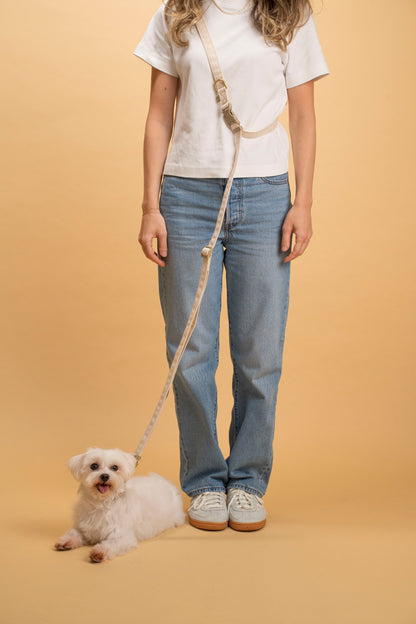 Hands-free dog leash with an adjustable strap for waist or shoulder use.