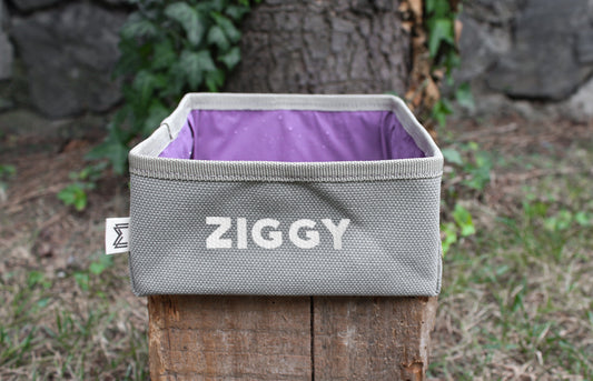 Personalized square travel dog bowl designed for easy portability.