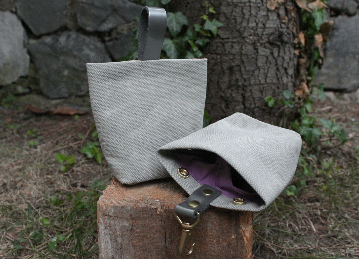 The gray Personalized Dog Treat Bag with a soft lilac lining, offering a subtle yet stylish contrast that adds a unique touch to your pet’s accessory.