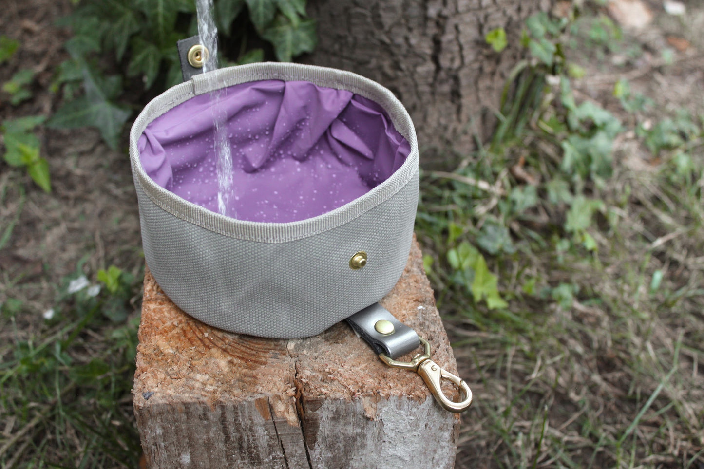 Travel-friendly gray dog bowl with a foldable and lightweight design.