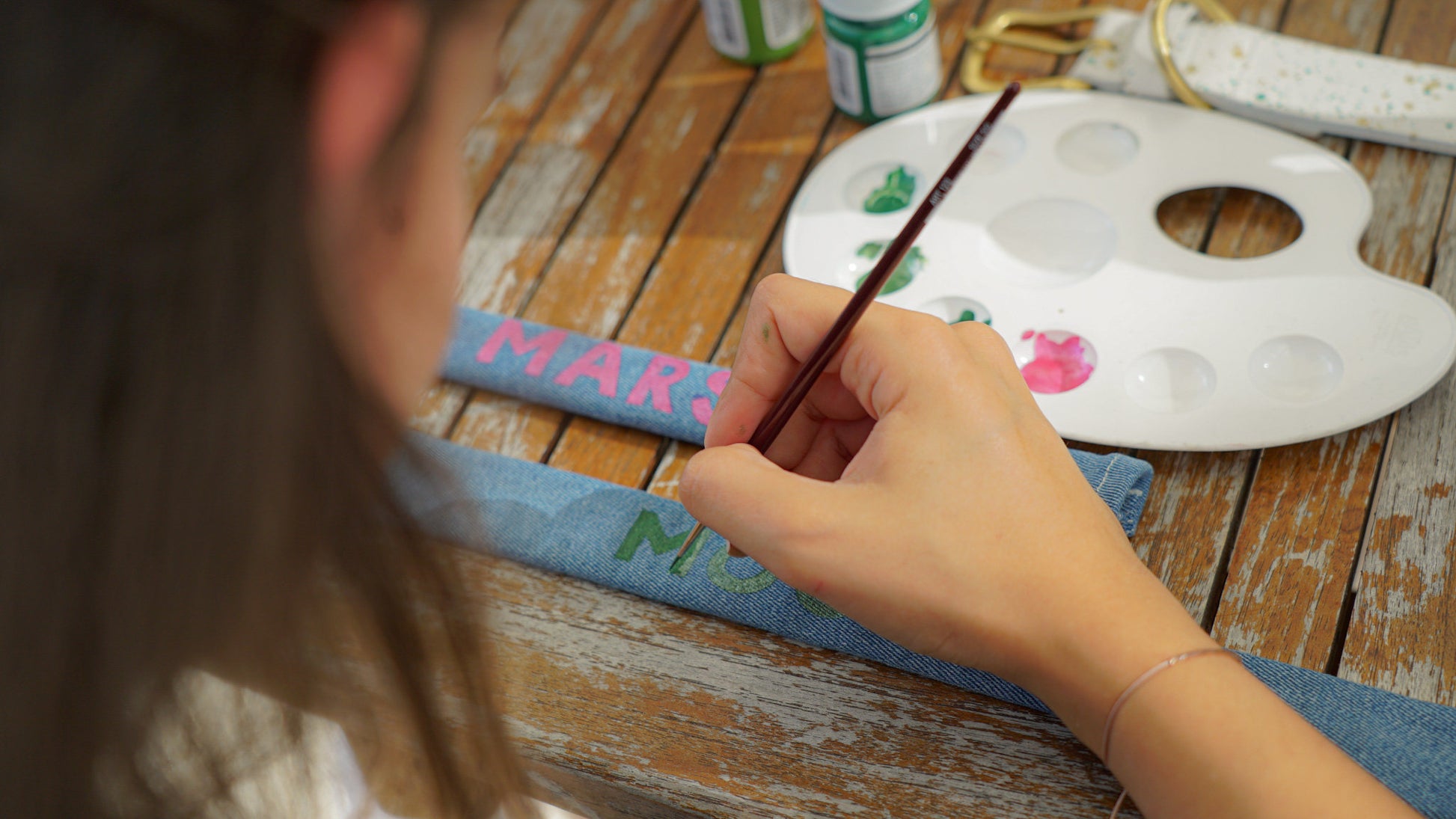 Hand-painted denim sleeve personalized for pet collars.