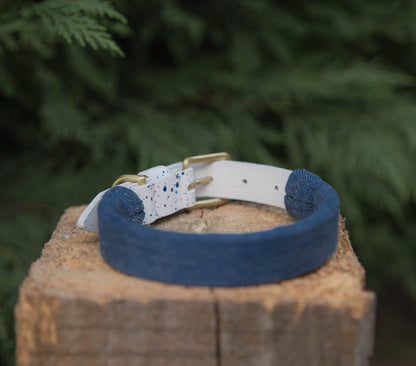 Denim accessory sleeve for pet collars, customizable for dogs and cats.